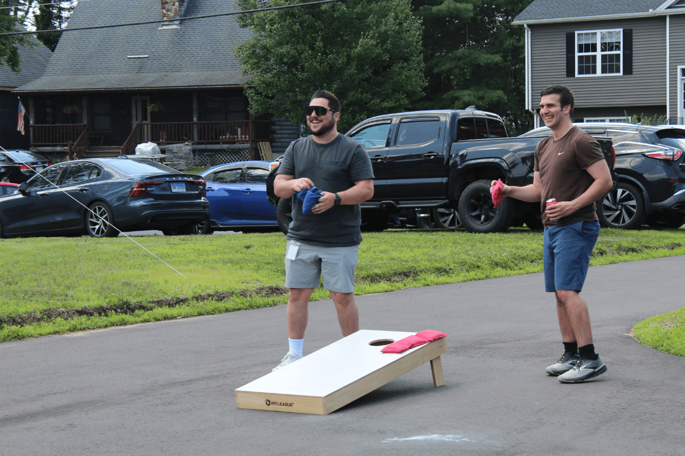ASG team members playing cornhole at the 2025 company party