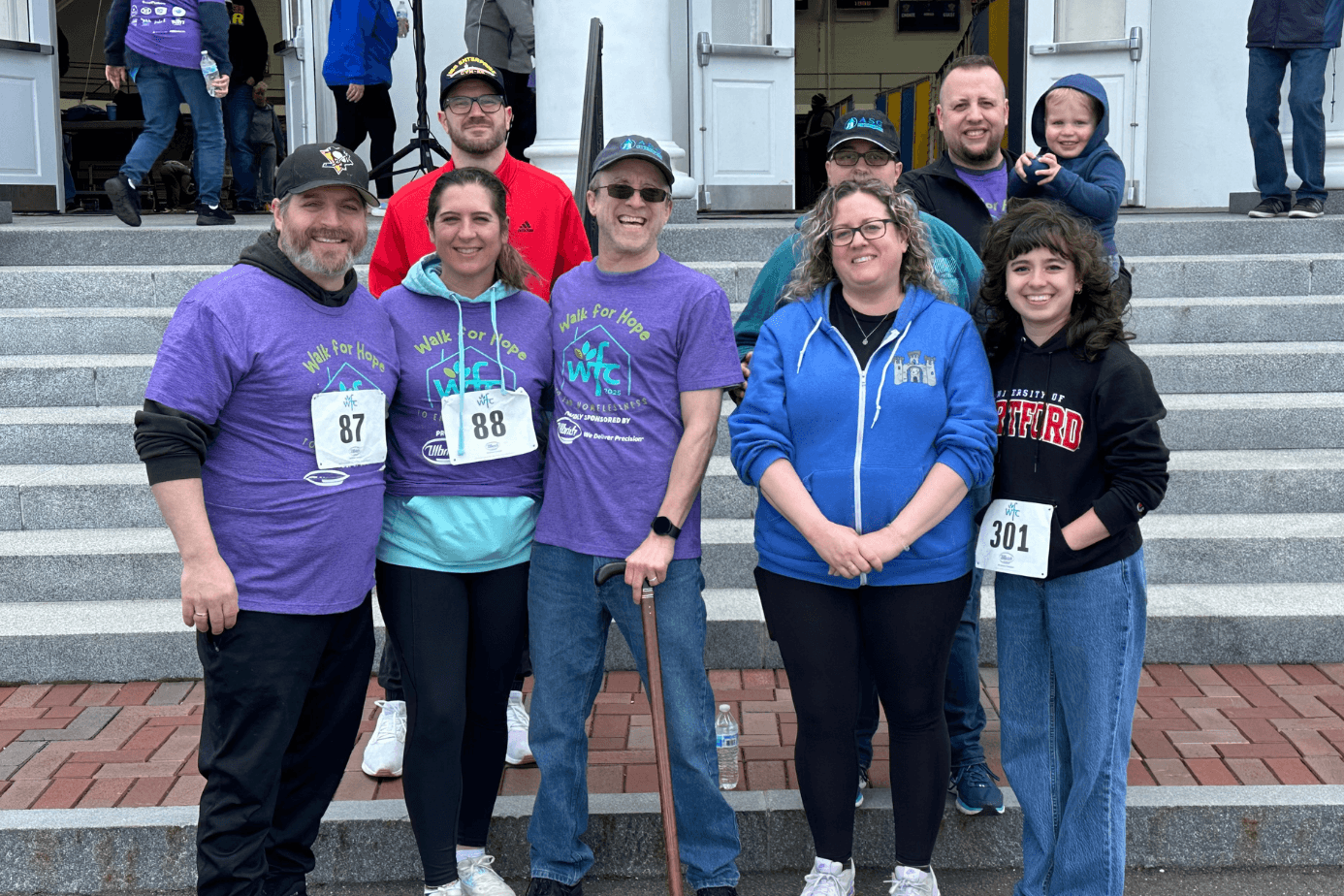 The ASG team gathered on the steps at the Walk for Hope charity event